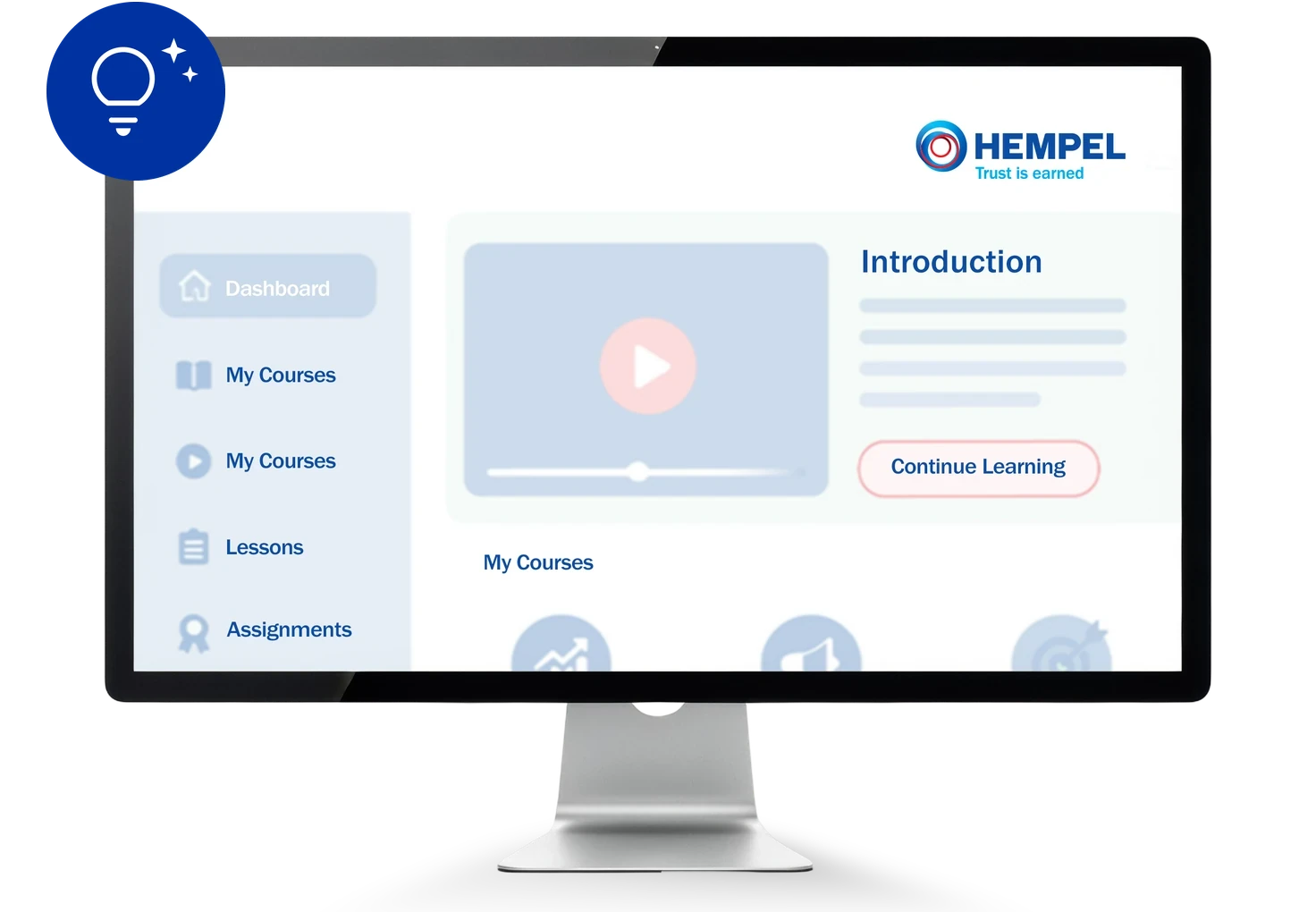 Desktop monitor showing a Hempel e-learning platform with courses, lessons and an introduction video.