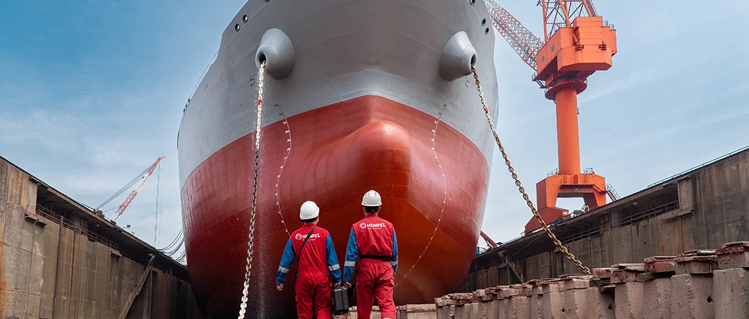 Two hempel advisors walking towards the vessel