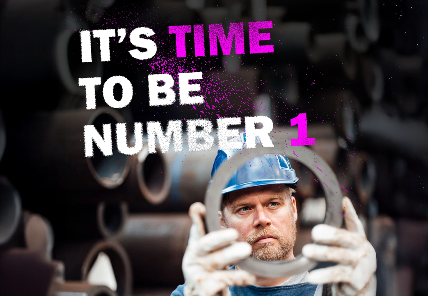 Worker in a helmet holding a metal part, with pipes in the background and the text 'It's time to be number 1.