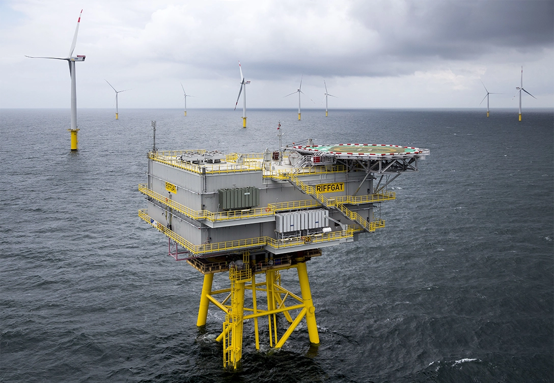 Offshore substation surrounded by wind turbines