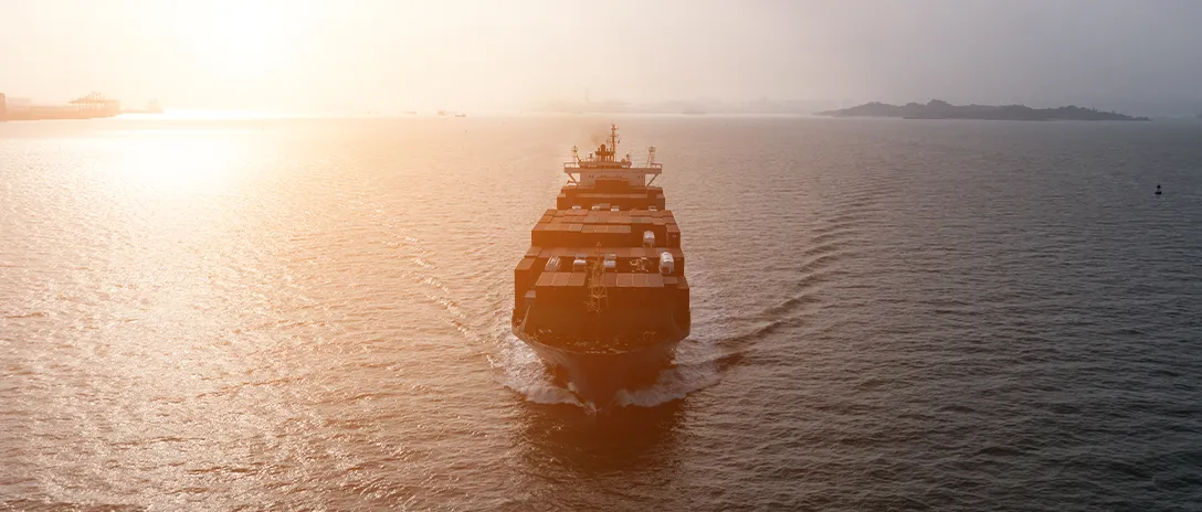 Container ship sailing in the middle of sea