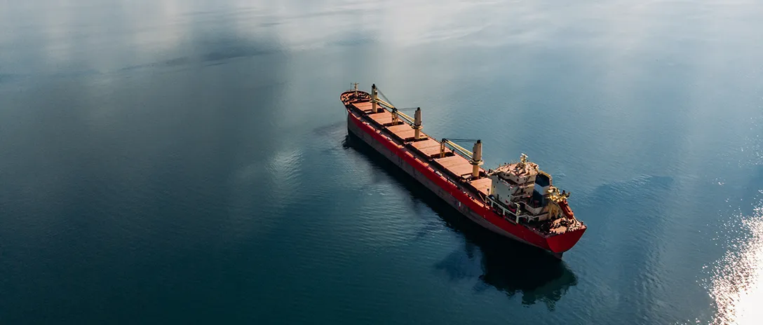 Red ship in the middle of sea