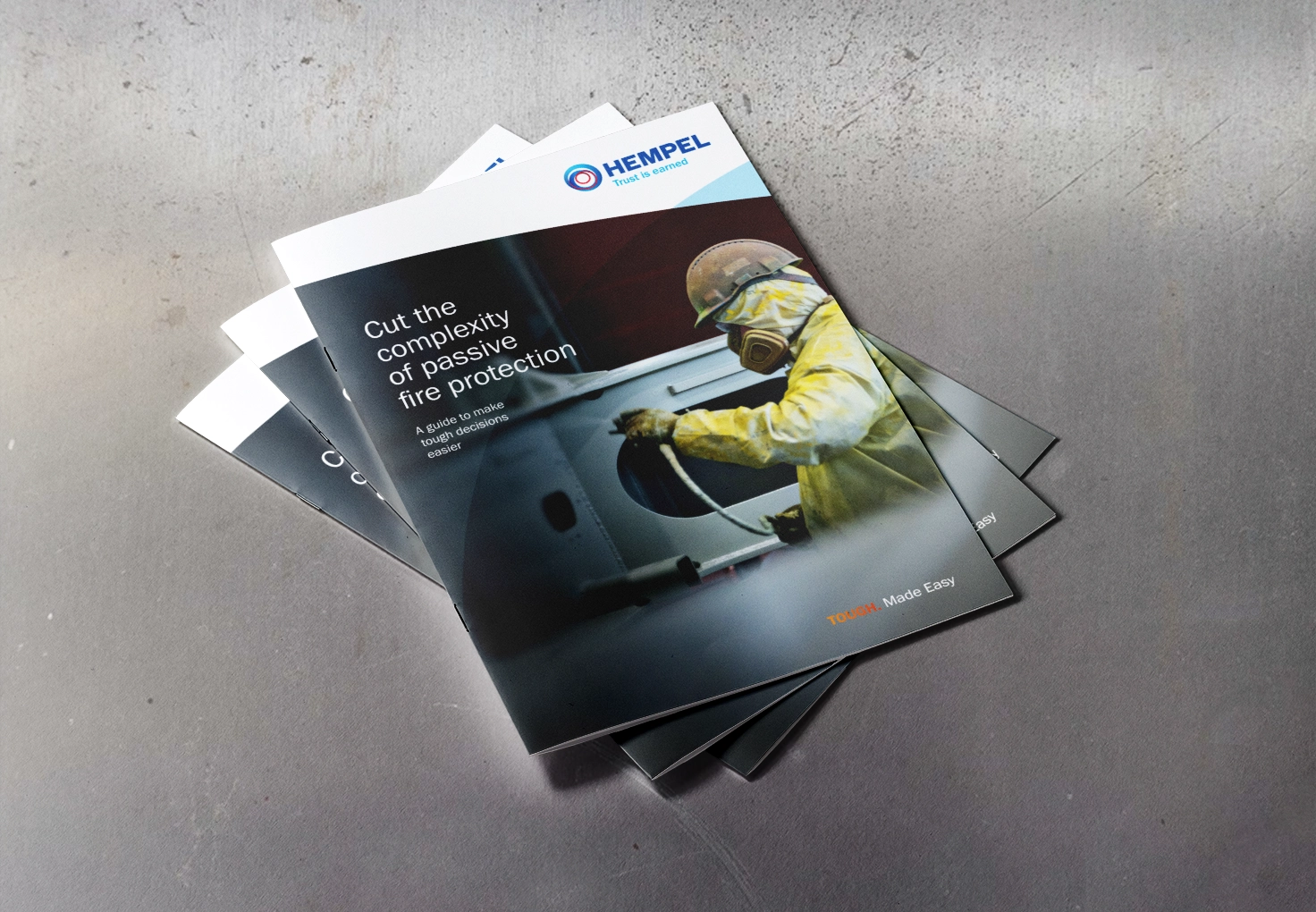 A brochure on passive fire protection featuring a man in a yellow jacket and mask, emphasizing safety and awareness.