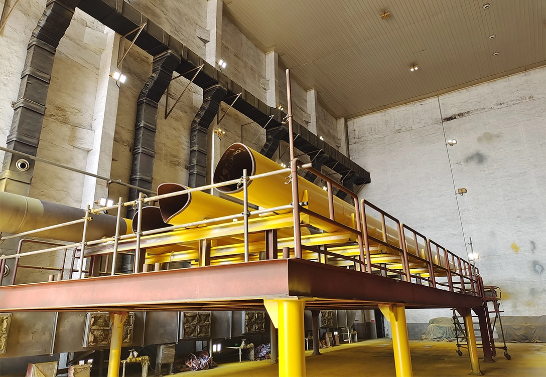 Yellow structural pipes of an offshore oil platform belonging to COOEC, coated with Hempaprime Strength for enhanced corrosion resistance and durability.