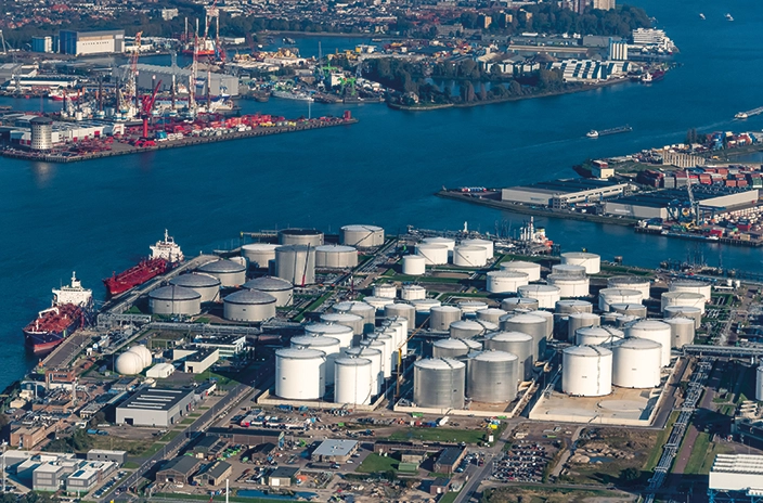 Overview of Koole's storage facility in Rotterdam, showing multiple large tanks by the waterfront.