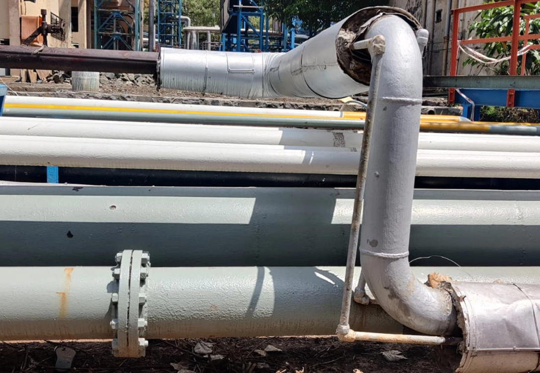 A pipeline section coated with Hempaprime CUI 275 at an oil and gas refinery in India.