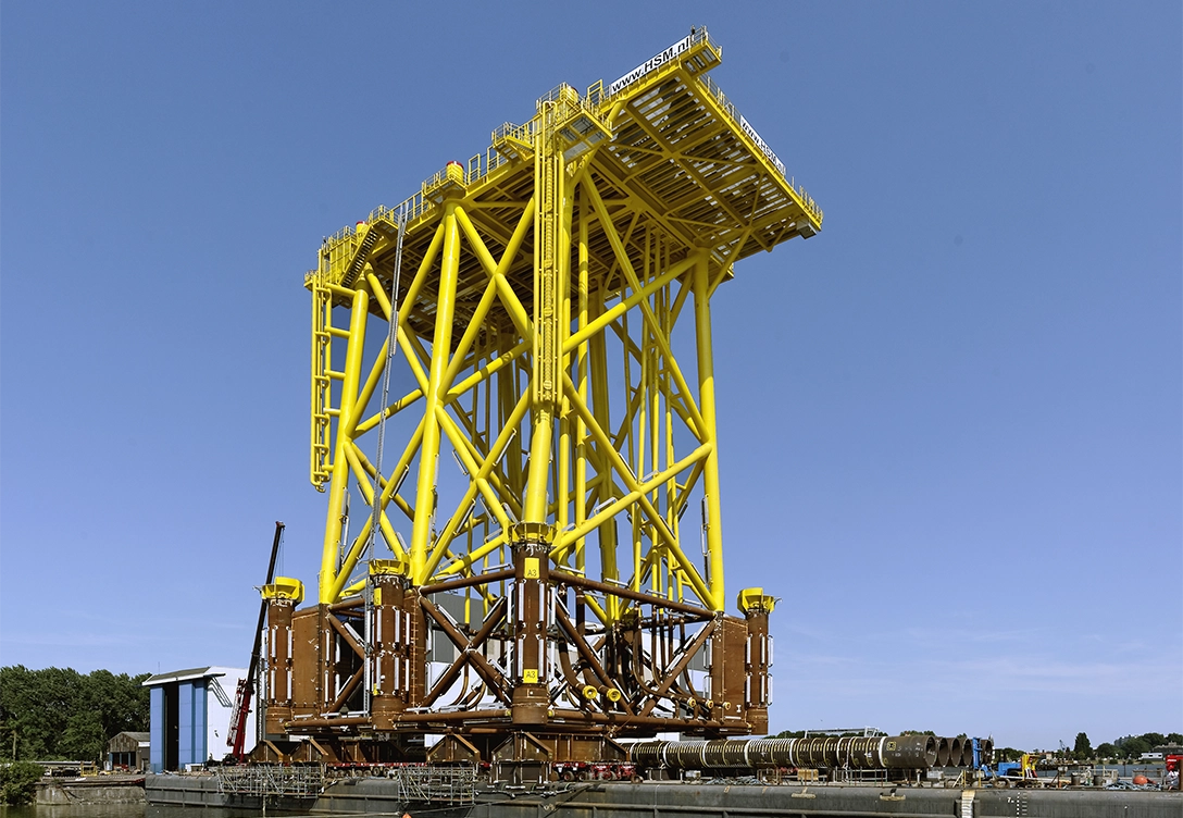 TenneT company's offshore wind platform structure painted yellow.