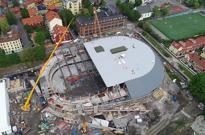 Jordal Amfi stadium construction with the roof halfway completed.