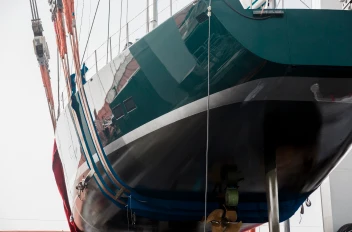 The hull of superyacht Saudade is shown raised for maintenance or coating work.