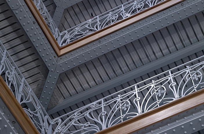 Decorative metal railings with patterns in La Samaritaine department store.