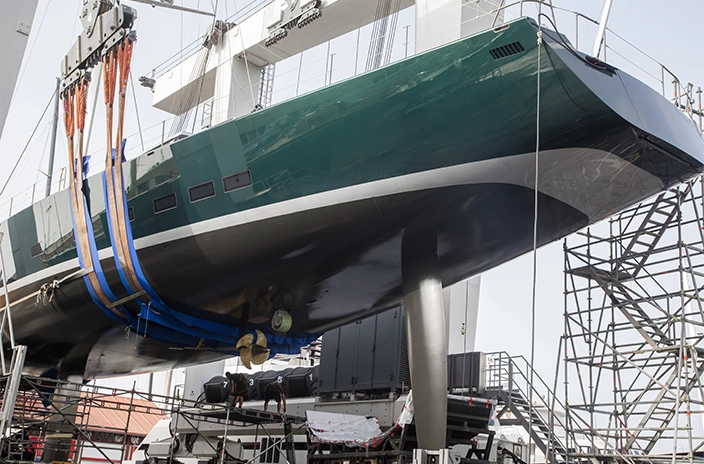 The hull of superyacht Saudade is shown raised for maintenance or coating work.
